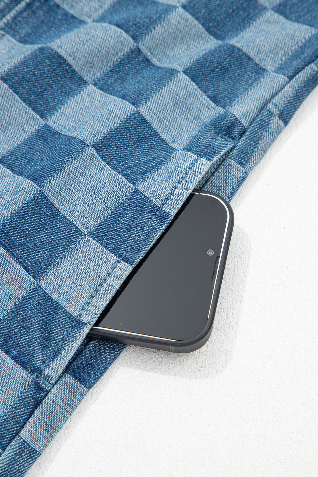 Threaded Pear Jessie Hem checkered mini dress displayed on a hanger, showcasing its stylish pattern and casual fit.