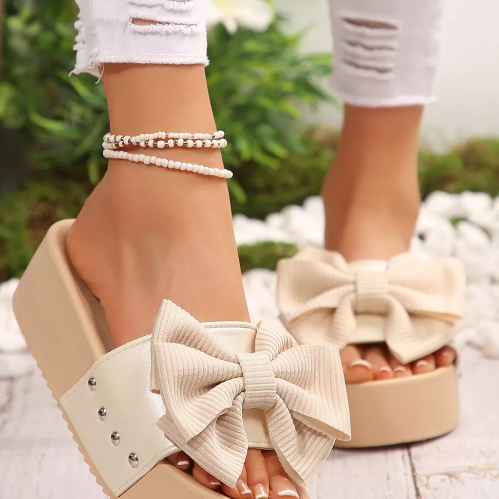 Women's chic bow decor platform sandals from Trendsi, featuring comfortable flat walking shoes with stylish bow accents and open toe design.
