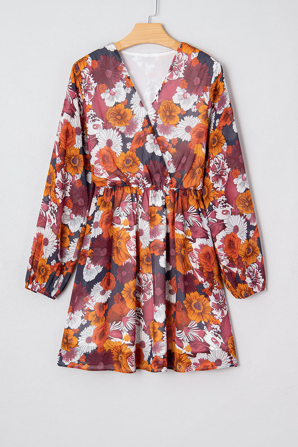 Flowy Marianna Sleeve Mini Dress by Threaded Pear featuring a vibrant floral pattern and lightweight fabric.