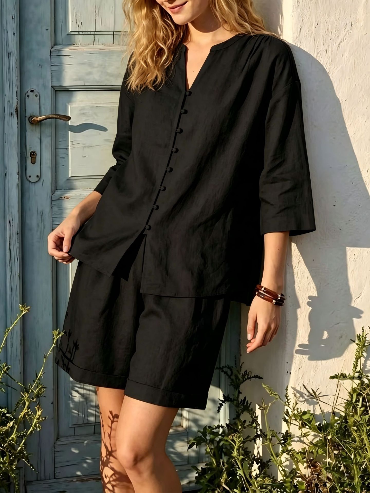 Women's V-neck top and high-waist wide-leg shorts two-piece casual set by FitiqueFit, shown in a stylish, comfortable fabric.
