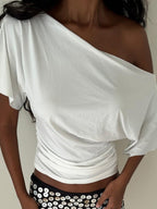 Women's one-shoulder ruched short sleeve T-shirt by Trendsi, featuring a chic stretch top with a stylish asymmetrical design.