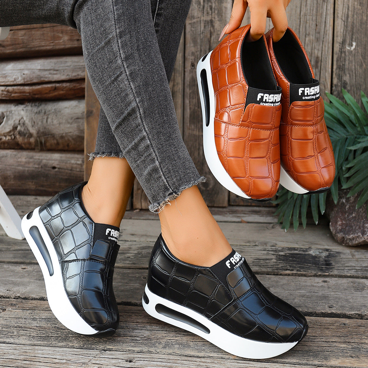 Women's crocodile pattern platform slip-on sneakers by Trendsi, faux leather casual shoes with a stylish, textured design.