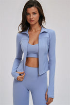 Fitglutes activewear sports bra, leggings, and zip jacket set for workout, featuring cross-back design and comfortable fit.
