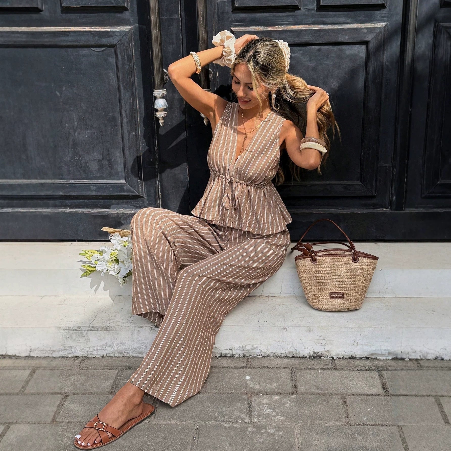 Women's striped sleeveless top and wide-leg pants two-piece casualwear set by Plush Fashion Hub, featuring a stylish and comfortable design.
