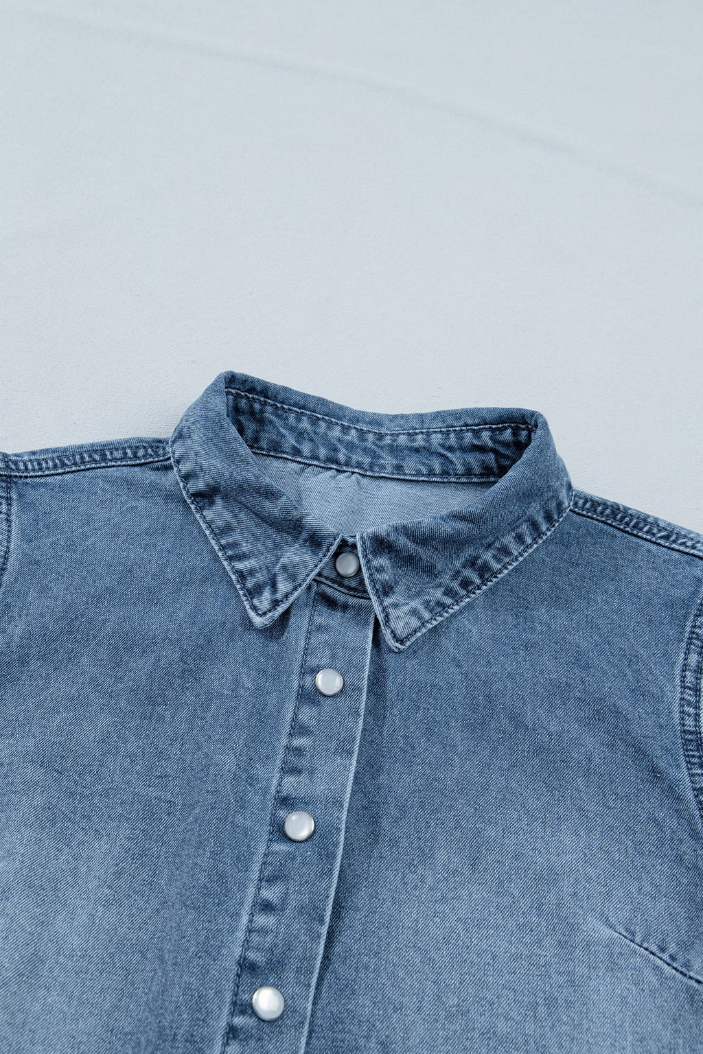 Ariana short sleeve snap shirt by Threaded Pear, featuring a stylish blouse with snap buttons and a comfortable fit.