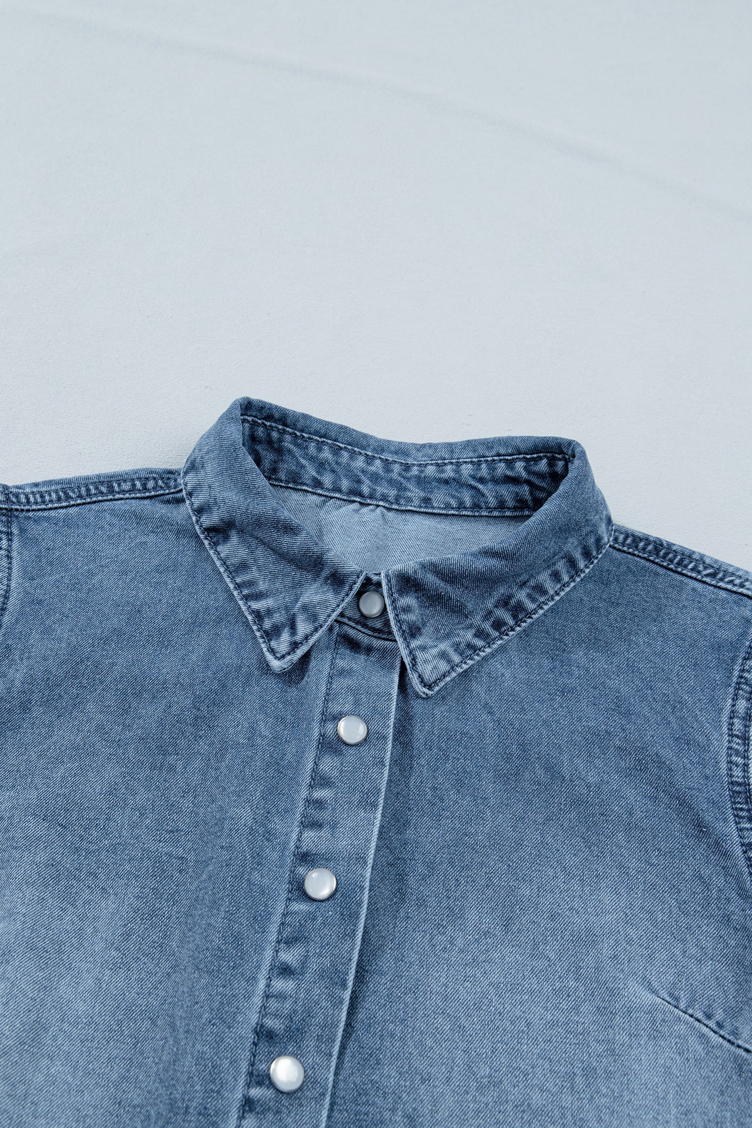 Ariana short sleeve snap shirt by Threaded Pear, featuring a stylish blouse with snap buttons and a comfortable fit.