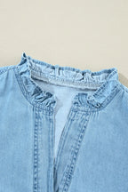 VYSN button-up notched long sleeve denim dress hanging on a wooden hanger, showcasing classic denim style and tailored fit.