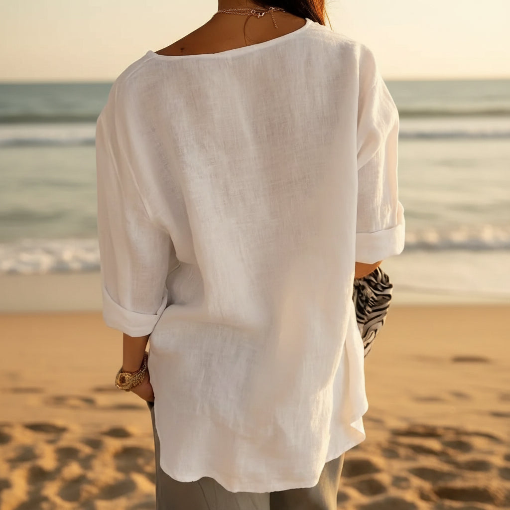 Women's loose fit V-neck long-sleeve button top by FitiqueFit, casual blouse with relaxed fit and front buttons, in a neutral color.