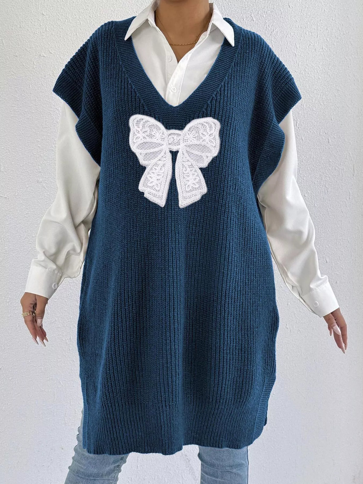 Embroidered Bow V-Neck Sweater Vest by Trendsi featuring a cozy knit fabric and elegant embroidered bow detail.