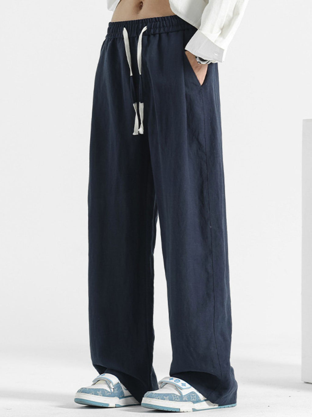 Men's casual loose fit pocket pants from Trendsi, featuring a relaxed style, comfortable stretch fabric, and practical side pockets.