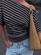 Women's striped one-shoulder T-shirt by Trendsi featuring a chic, asymmetrical design and comfortable fit.
