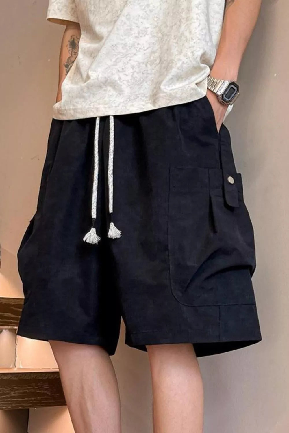Plus size men's drawstring shorts with pockets, featuring a casual style and comfortable fit, from Trendsi.