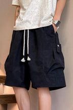 Plus size men's drawstring shorts with pockets, featuring a casual style and comfortable fit, from Trendsi.