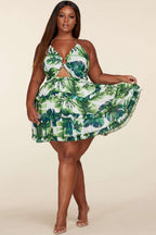 Fasheabe plus size leaf print O-ring mini dress featuring a vibrant leaf pattern, fitted silhouette, and stylish O-ring detail.