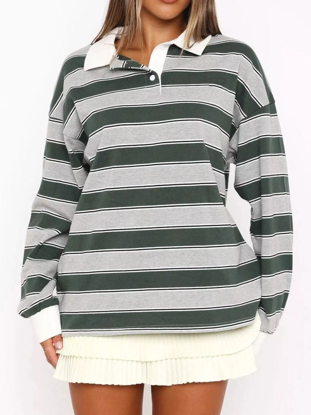 Striped long sleeve polo top with button details from Trendsi, featuring a classic design and versatile style.