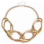 18K gold-plated chain necklace from Shopimist, close-up of the delicate, shiny jewelry with intricate link details.