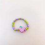 Colorful fruit charm beaded ring showcasing vibrant fruit designs, crafted by Shopimist, perfect for casual or fun fashion accessories.