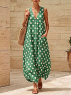 Polka dot V-neck sleeveless maxi dress by Shopimist featuring a flowing silhouette and stylish design.