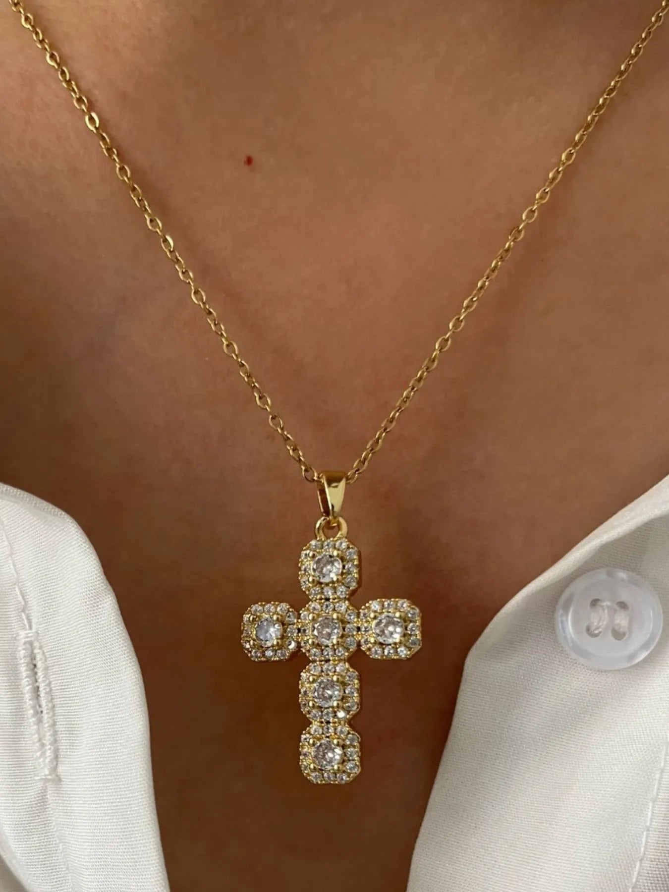 Stainless steel inlaid zircon cross necklace with polished finish, featuring a sleek design and sparkling zircon accents.