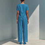 Plus size women's casualwear set featuring a loose short-sleeve top and high-waist pants by FitiqueFit, shown in a relaxed fit style.