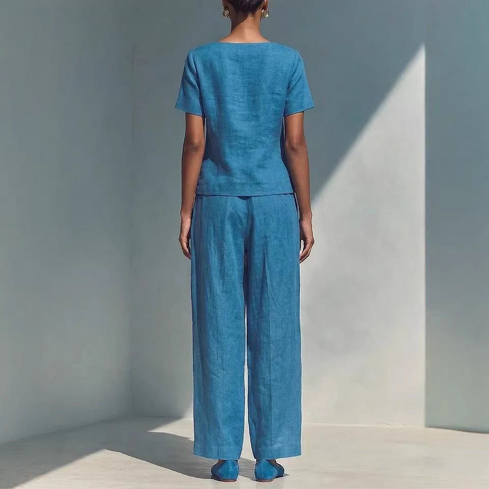 Plus size women's casualwear set featuring a loose short-sleeve top and high-waist pants by FitiqueFit, shown in a relaxed fit style.