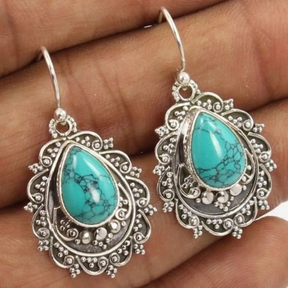Turquoise alloy teardrop dangle earrings with intricate detailing, stylish jewelry accessory from Plush Fashion Hub