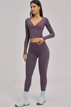 Black long sleeve crop top from Fitglutes Activewear, featuring a fitted design ideal for gym and workout sessions.