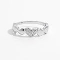 925 Sterling Silver Heart Ring with inlaid zircon stones, showcasing a delicate and elegant jewelry design.