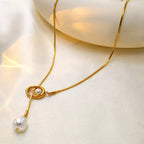 Elegant pearl pendant necklace by Shopimist featuring a single lustrous pearl on a delicate chain.