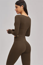 Fitglutes Activewear long sleeve crop top from The Swoon collection, shown in black with fitted style and crew neckline.