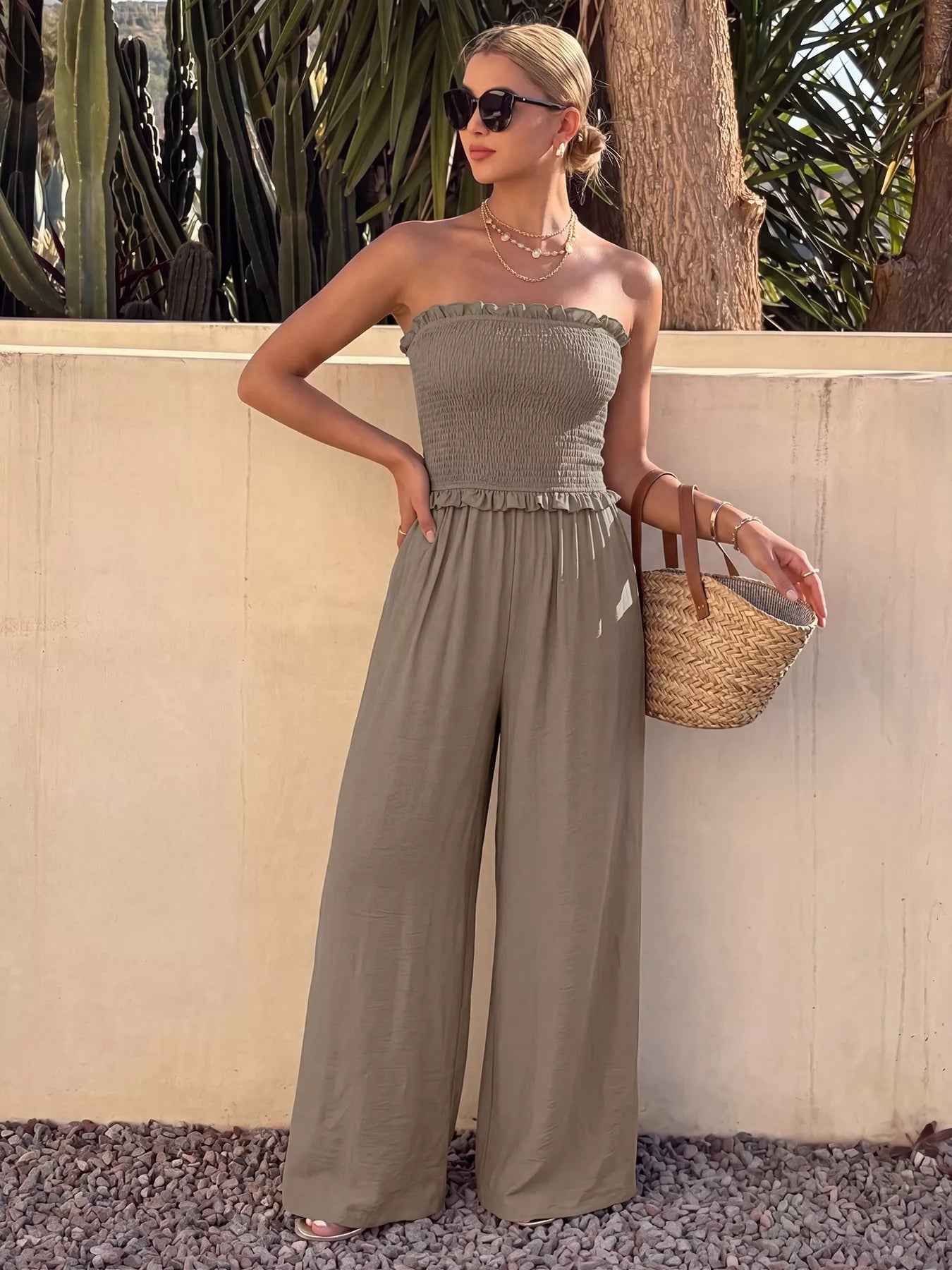 Smocked strapless wide-leg jumpsuit by Plush Fashion Hub, featuring a relaxed fit and stylish design in the image.