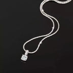 Sterling silver moissanite necklace with 1 carat center stone, elegant jewelry piece from Shopimist featuring sparkling gemstone.
