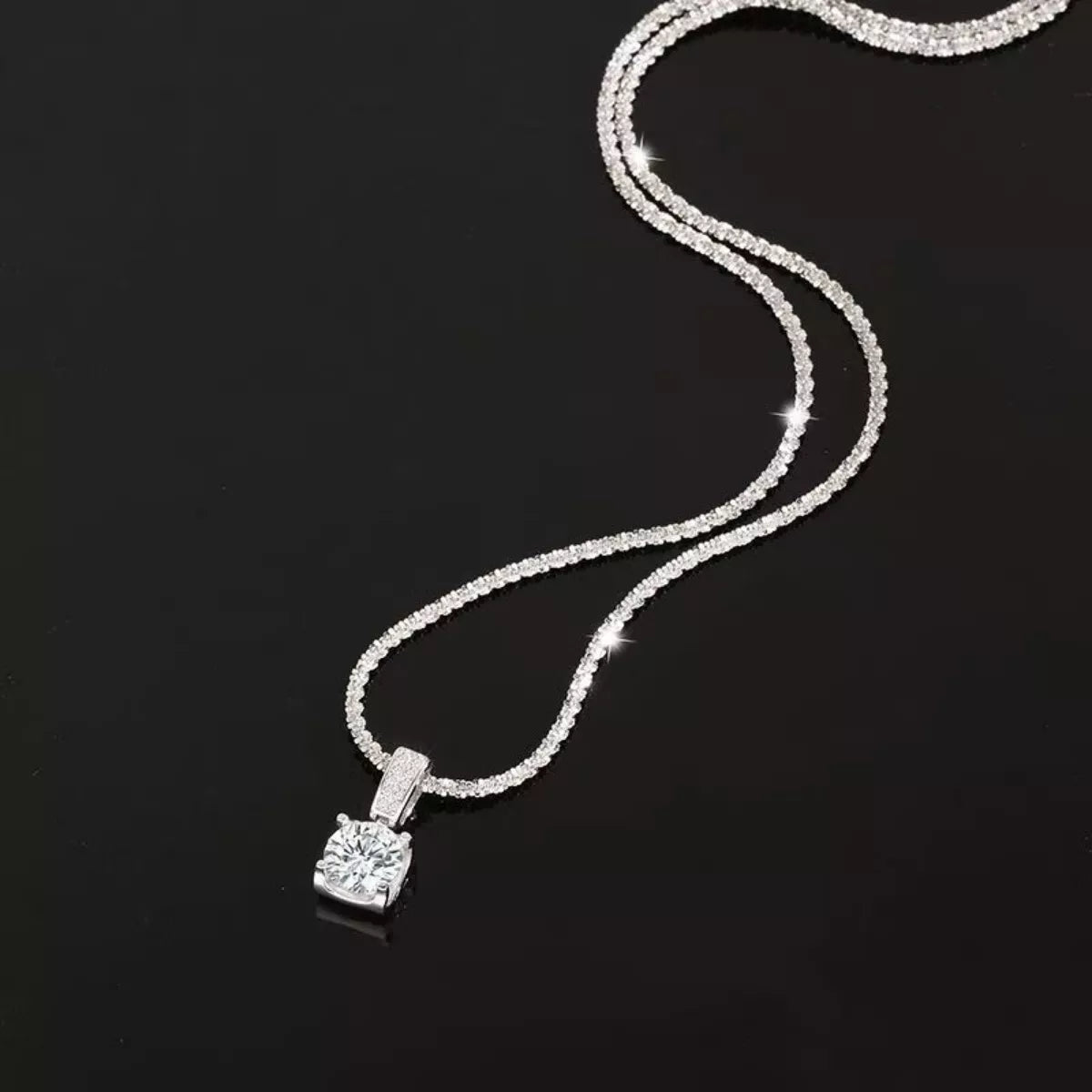 Sterling silver 1 carat moissanite necklace with a sparkling pendant, elegant jewelry piece from Plush Fashion Hub.