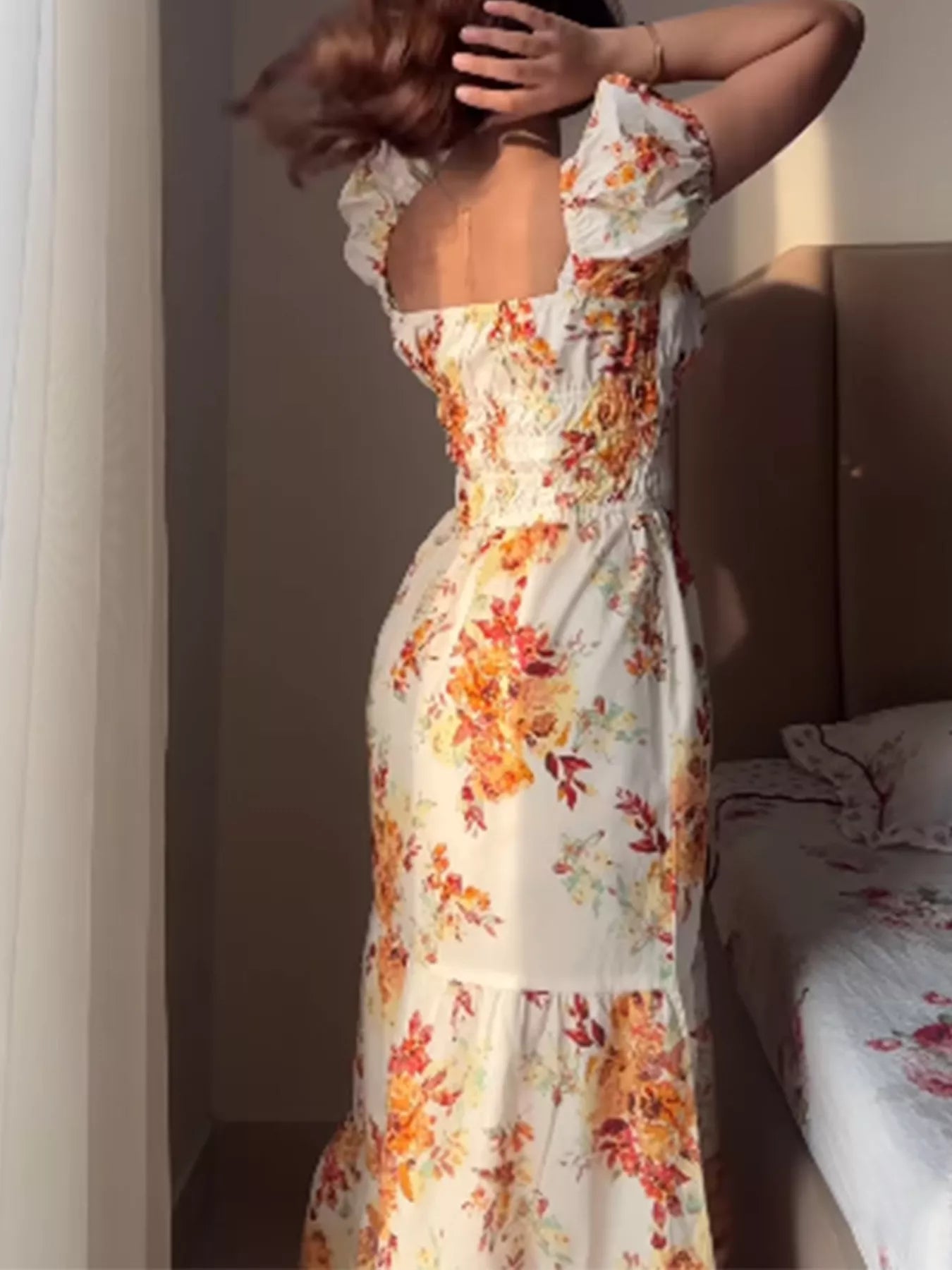 Women's floral print short sleeve ruched maxi dress by Trendsi, featuring a flowy silhouette and vibrant floral pattern.