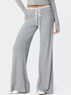 Women's elegant wide leg lounge pants by Trendsi with lace trim and tie waist, shown in a relaxed fit.