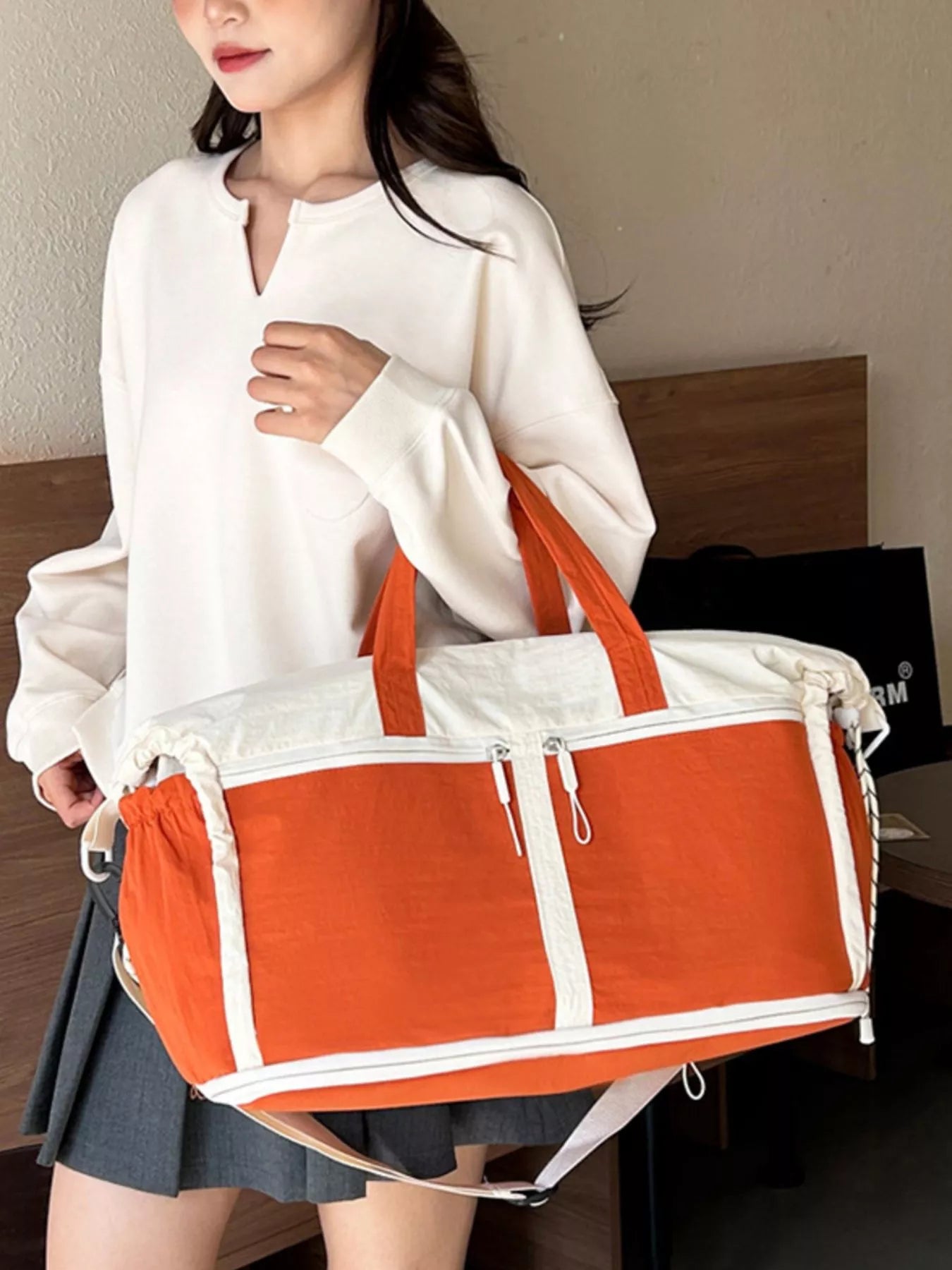 Color-block travel bag by Plush Fashion Hub with multiple compartments and bold color panels, ideal for organized travel.