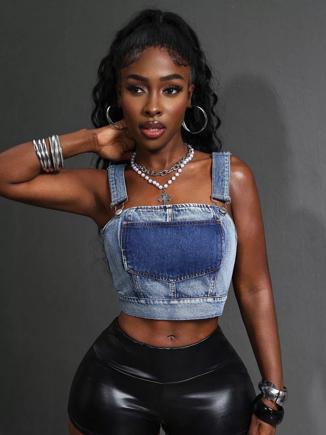 Cropped denim top with adjustable straps from Plush Fashion Hub, featuring a stylish fit and classic blue denim fabric.