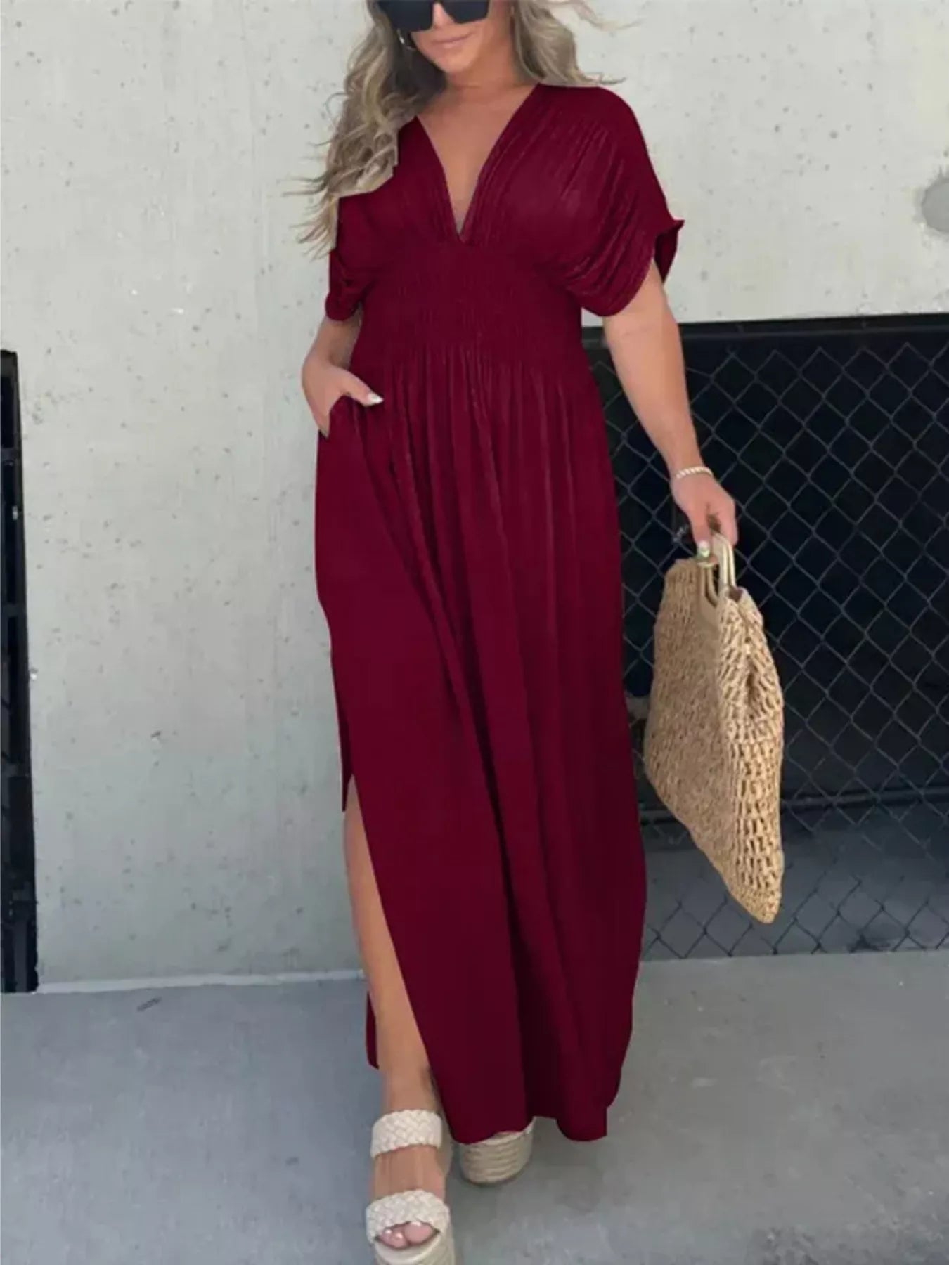 Plus size maxi dress with slit V-neck, smocked waist, full length, by Trendsi, featuring flowing fabric and elegant design.