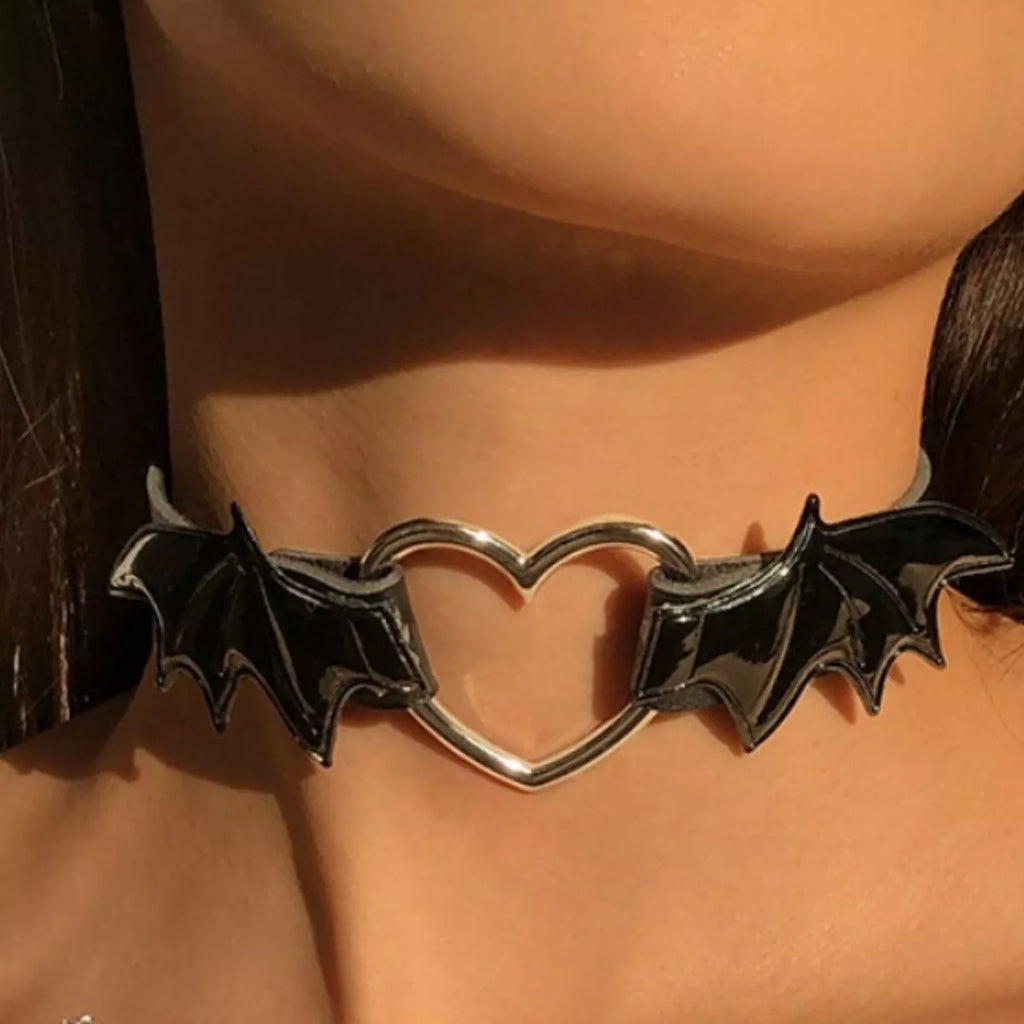 Gothic black choker necklace with bat wing and heart design from Shopimist, featuring dark, edgy jewelry style.