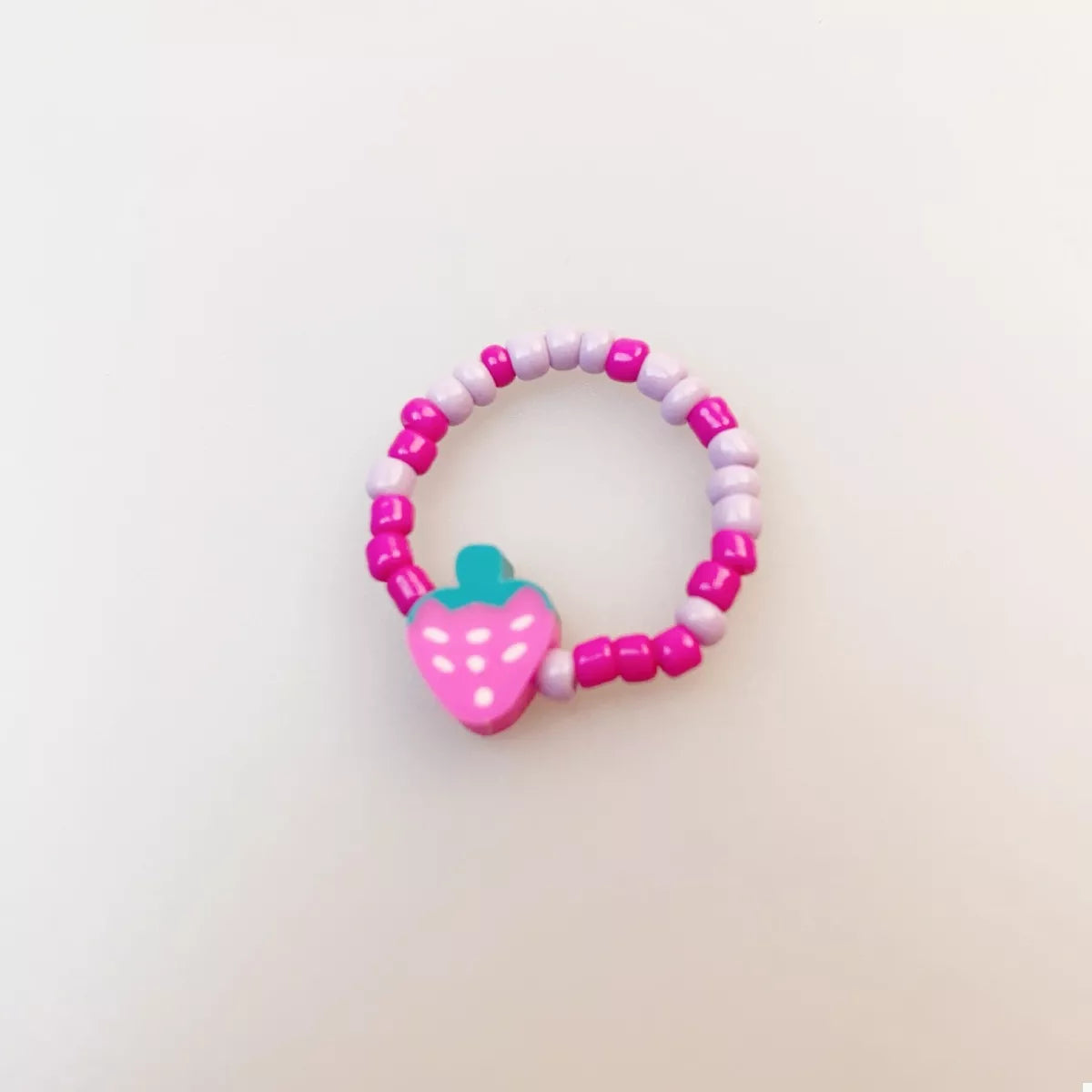 Colorful fruit charm beaded ring from Shopimist featuring vibrant beads and a playful fruit design.