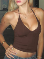 Women's sleeveless halter neck slim fit cami top by Trendsi, featuring stretch fabric and a sleek, fitted design.