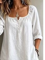 Button detail long sleeve top from Trendsi featuring a fitted design with button accents and a soft, comfortable fabric.