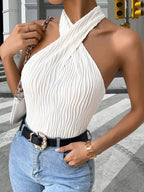 Textured halter neck tank top from Plush Fashion Hub, featuring a stylish design and comfortable fit, shown in the image.
