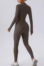 Trendsi half zip mock neck active jumpsuit showing a sleek, fitted design with a high neckline and full-length legs.
