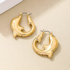 18K gold-plated dolphin hoop earrings with a shiny finish, featuring detailed dolphin designs for a stylish and elegant look.