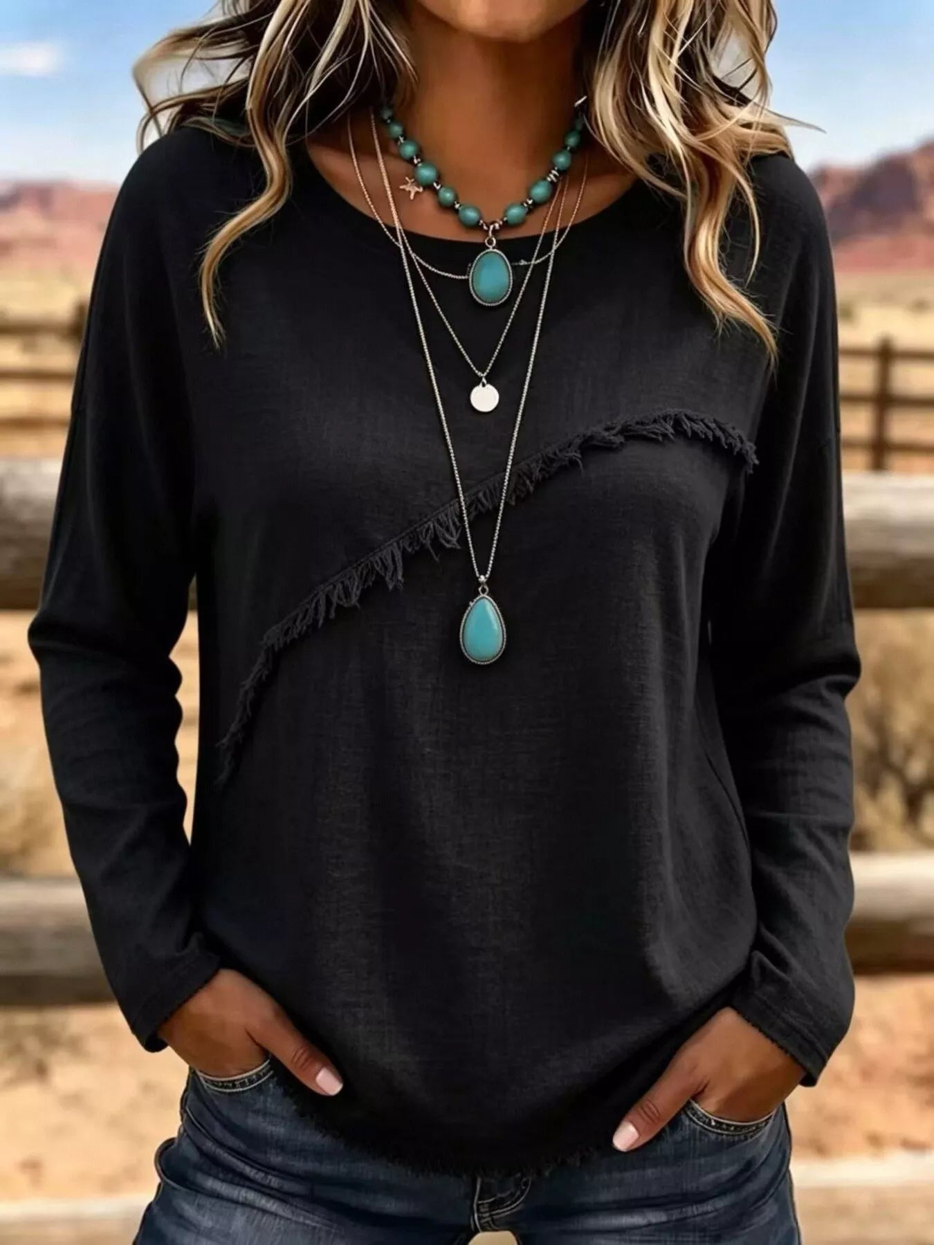 Plus size long sleeve T-shirt with fringe detail, trendy tops by Trendsi featuring stylish fringe accents on the sleeves.