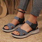 Women's open toe woven strap flat sandals with faux leather slides, featuring a comfortable, stylish design.