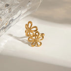 Stainless steel flower ring with intricate floral design, shiny finish, and adjustable band, crafted by Shopimist.