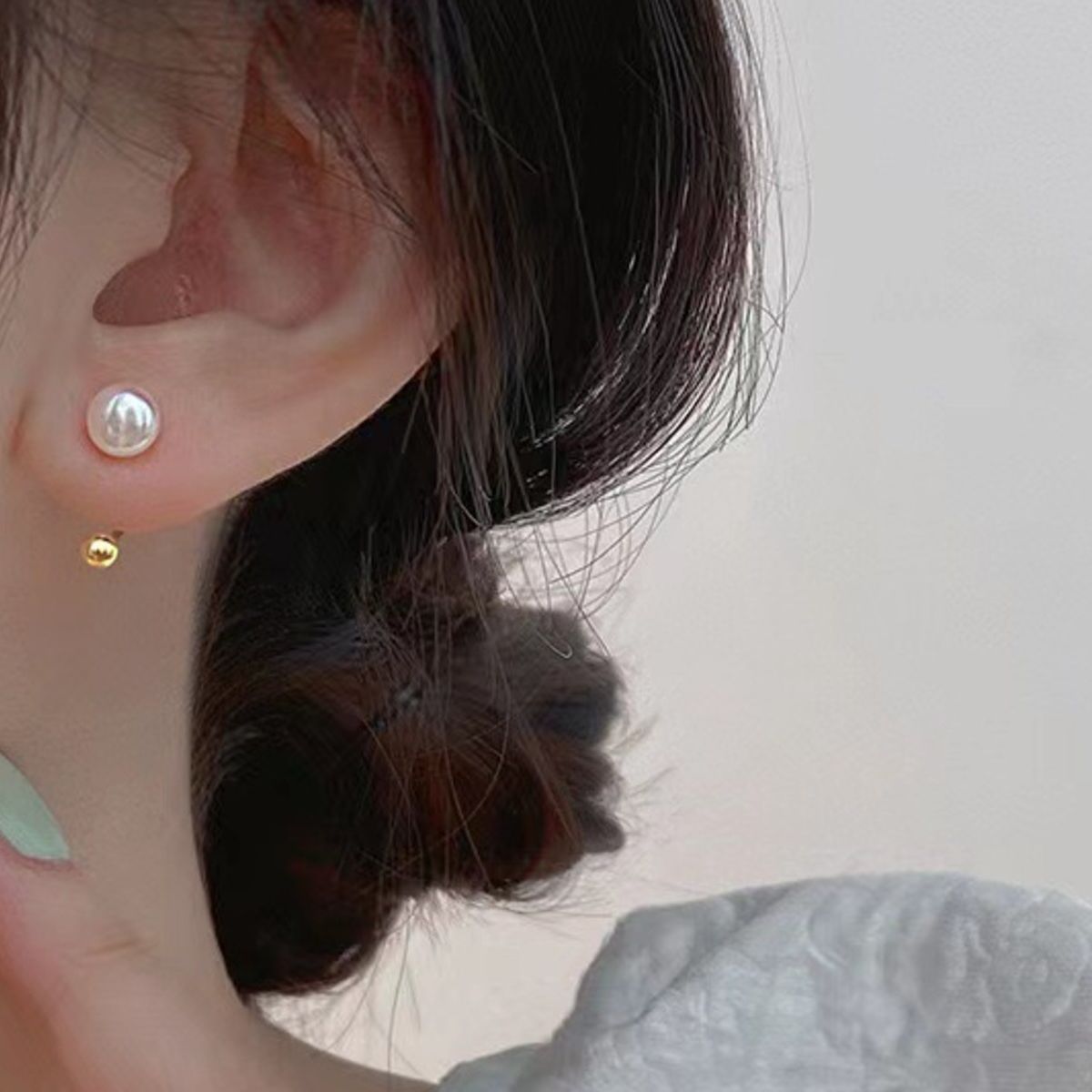 Sterling silver pearl stud earrings with smooth round pearls, crafted by Plush Fashion Hub, showcasing elegant jewelry design.
