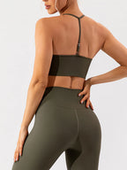 Trendsi spaghetti strap active bra in black, featuring lightweight, breathable fabric and adjustable straps for comfortable workout wear.